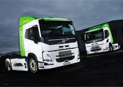 A creative photograph of two brand new Electric powered Volvo tractor units supplied to SPAR RDC A.F.Blakemore & Son Ltd in Willenhall, West Midlands